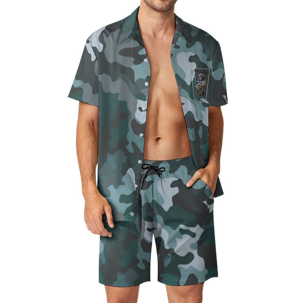 A man wearing a Mens Blue Graphite Camouflage Shirt Shorts Set with a Veteran Logo.